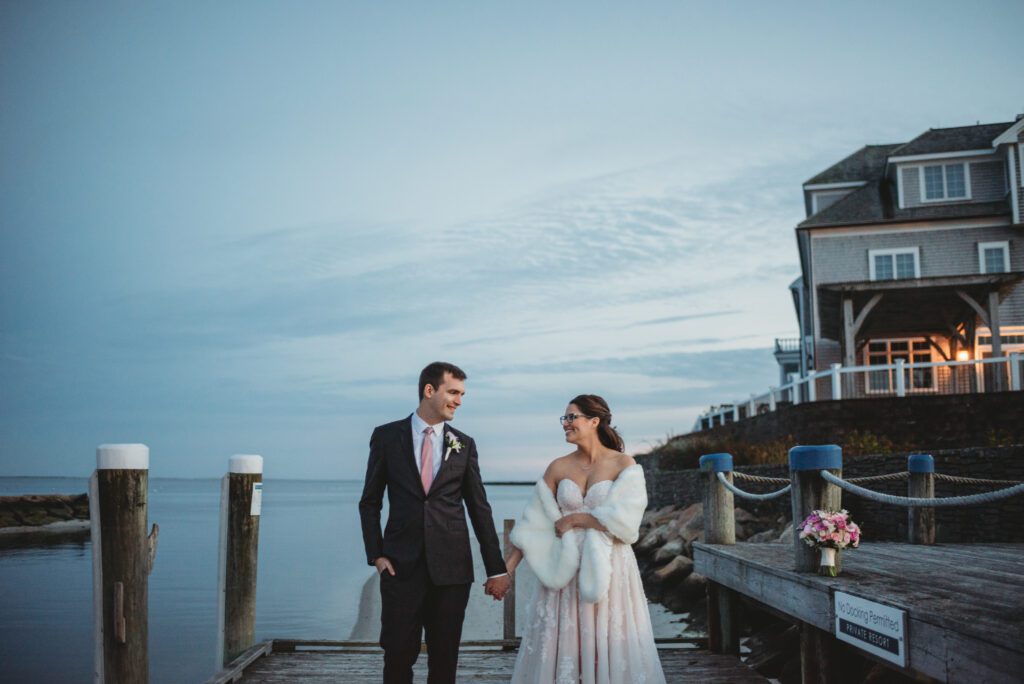Beautiful autumn wedding reception in the Ocean Room at Wychmere Beach Club, Cape Cod, with sunset views, captured by Sarah Murray Photography