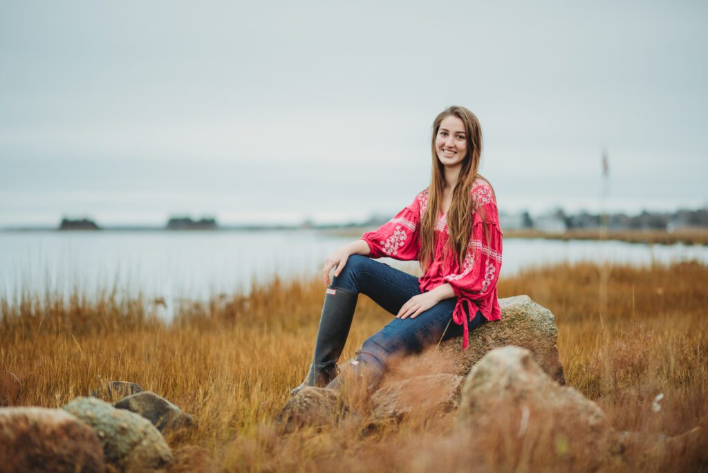 Senior portrait session in the serene marshlands of Fairhaven, capturing the natural beauty and individuality of a high school senior captured by Sarah Murray Photography